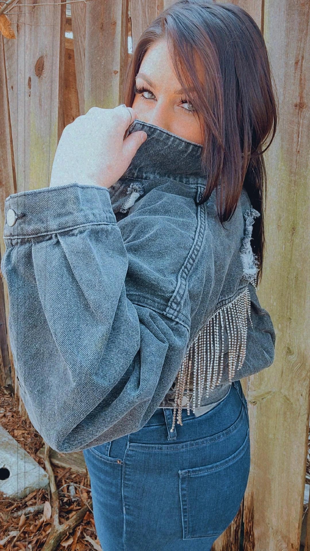.Color Black  .Destroyed  button down rhinestone fringe back cropped washed denim jacket.  .Loose fit style.  .I would recommend hand washing or dry cleaning.  .Felicia normally wears a size large but did size down to a medium.