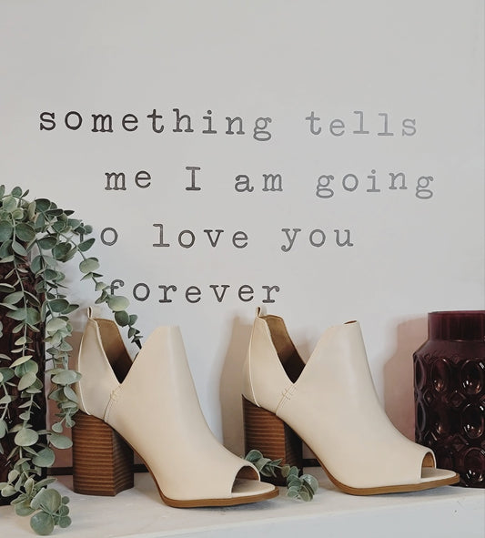 . Color Bone  . A beautiful Open toe bootie Features a deep V ankle cut style.  . True to size and a beautiful fit.  . This will be your go to booty this spring and   summer.  . Felicia wears a size 8.
