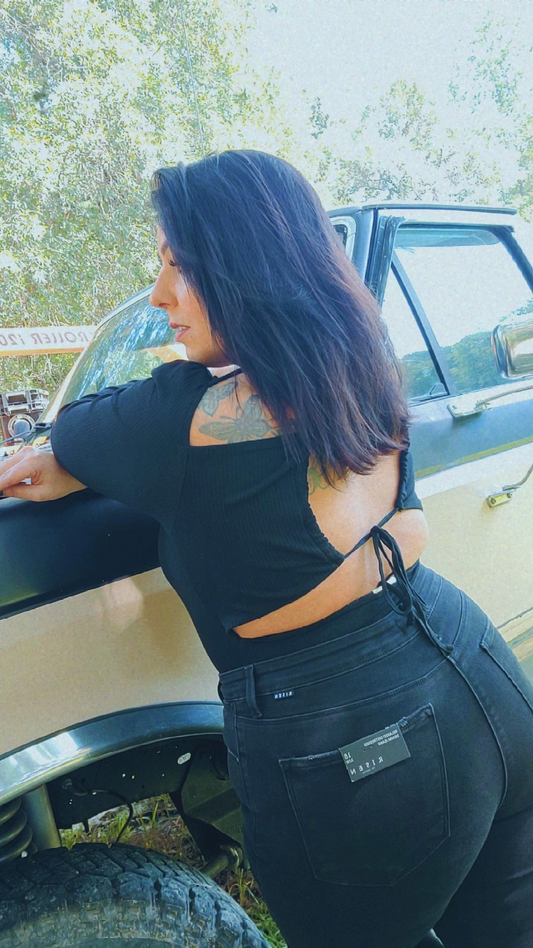 Black long sleeve body suit with an open back tie design.